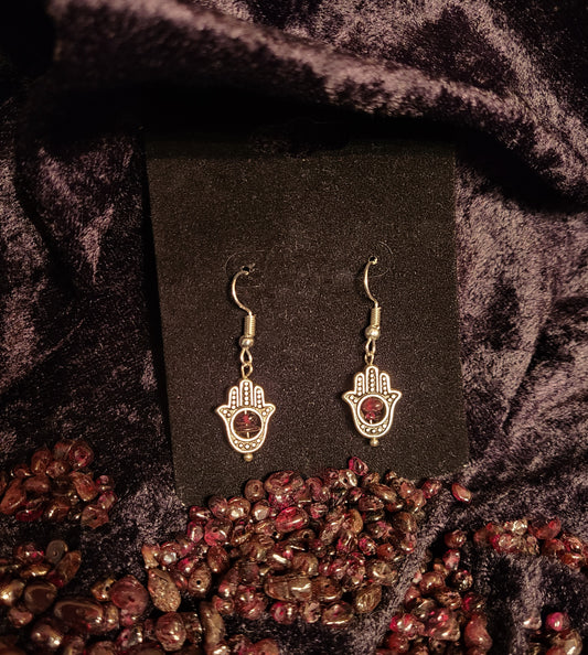 Hands of Fatima earrings bearing red garnet