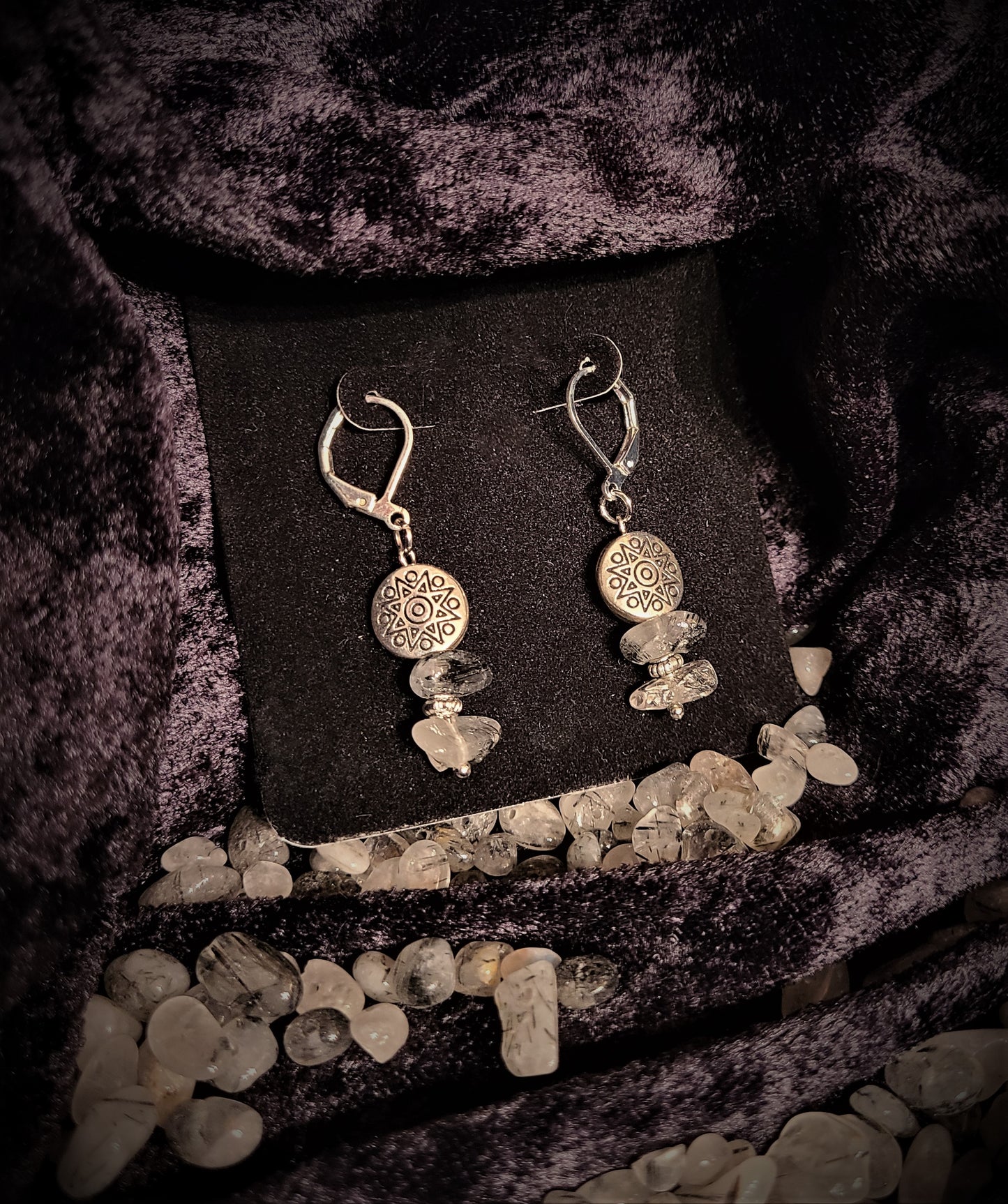 Earrings with silver lentils atop tourmalated quartz