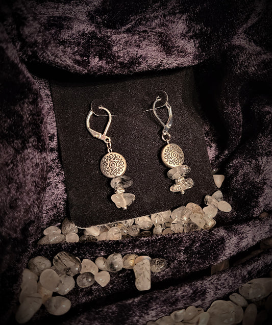 Earrings with silver lentils atop tourmalated quartz