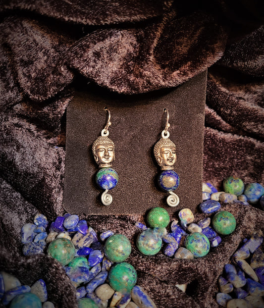 Earrings with silver Buddha head atop lapis lazuli