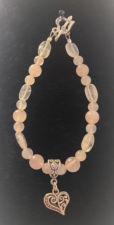 Rose quartz bracelet with silver heart pendant